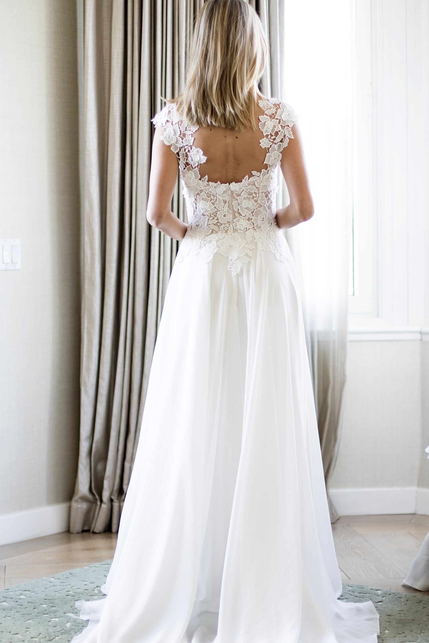 Morning back detail designer wedding dresses by Caroline Castigliano